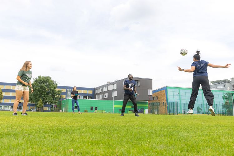 Yamuna (right), Brian (centre) and Mariana during their last joint training on the Football pitch at the Sports Science Faculty campus. They once more practice precise headers. In the background: Sandra Penkalla. Picture: Swen Reichhold