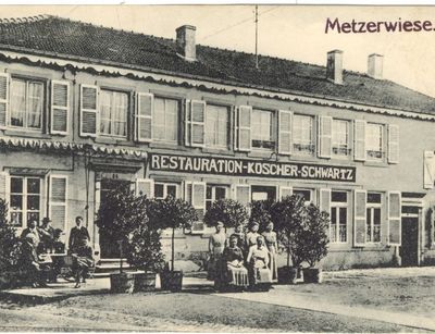 Historical Postcard showing a restaurant in Metzerwiese with people in front